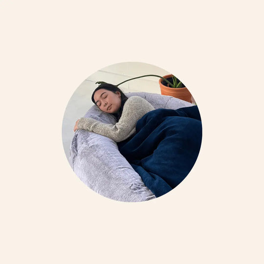 Girl sleeping in Arctic Grey Plufl Human Dog Bed